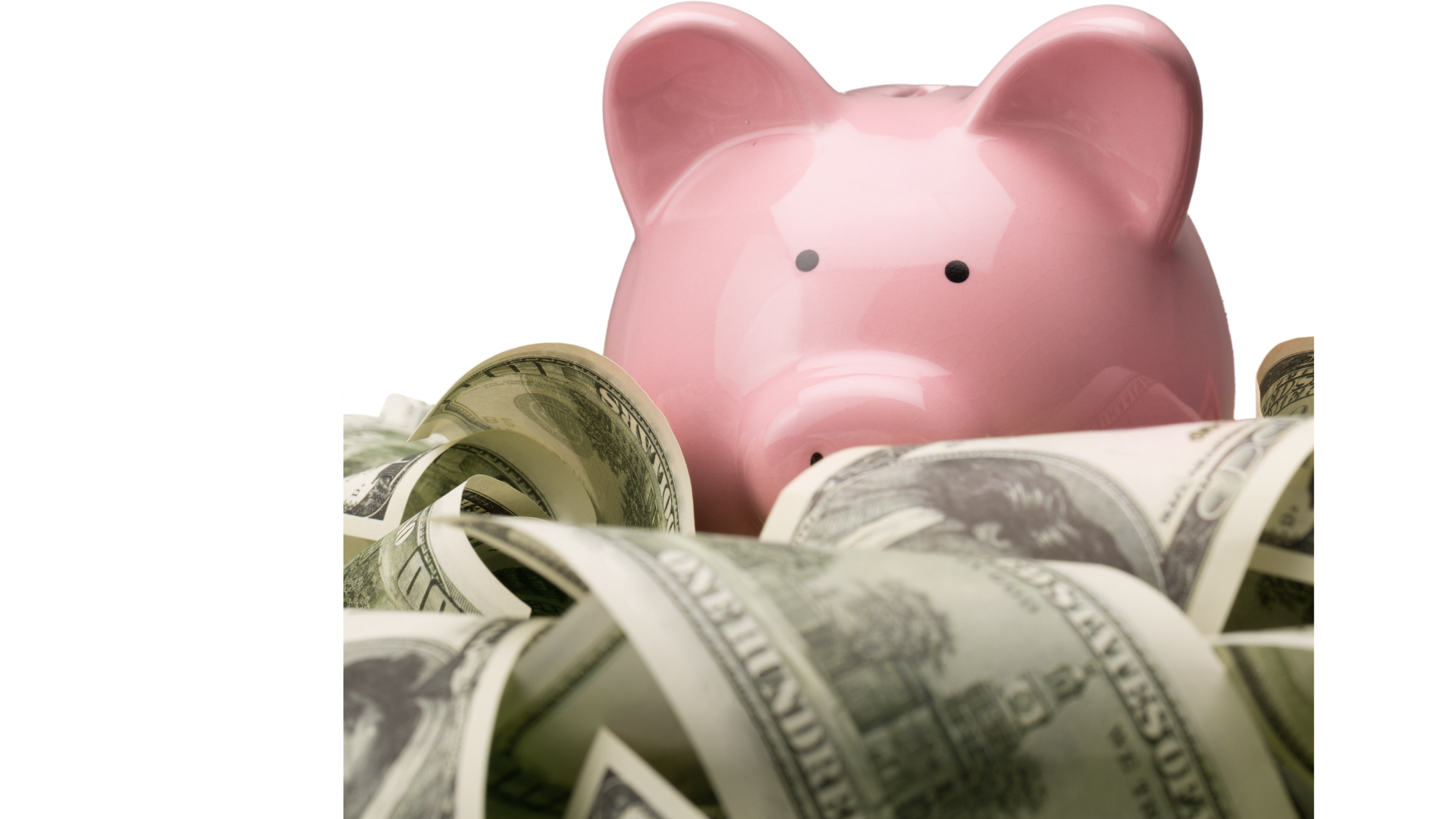 Piggy bank with paper currency and coins around it